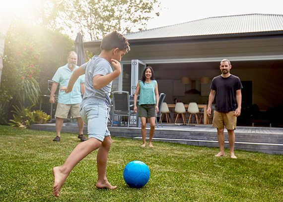 family playing soccer