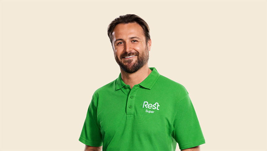 man in green shirt smiling