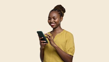 Smiling woman looking at her smartphone