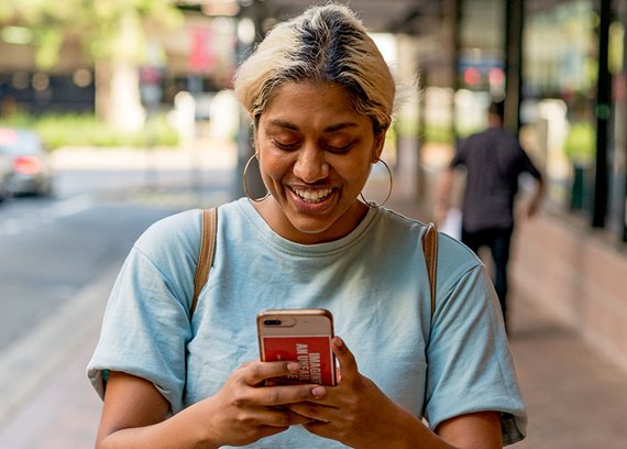 rest members smiling at phone